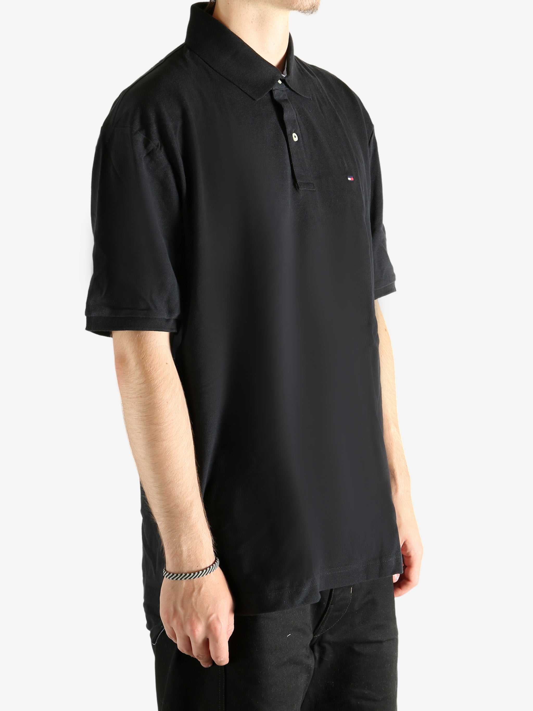 Black T-shirt worn by a person, showing the T-shirt's fit