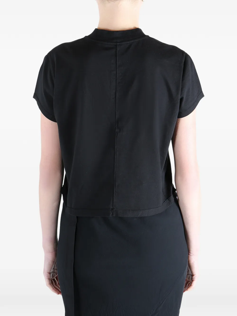 Black t-shirt worn by a person, showing the t-shirt fit