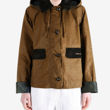 Brown jacket worn by a person, showing the jacket fit