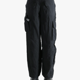 Black pants worn by a person, showing the pants fit