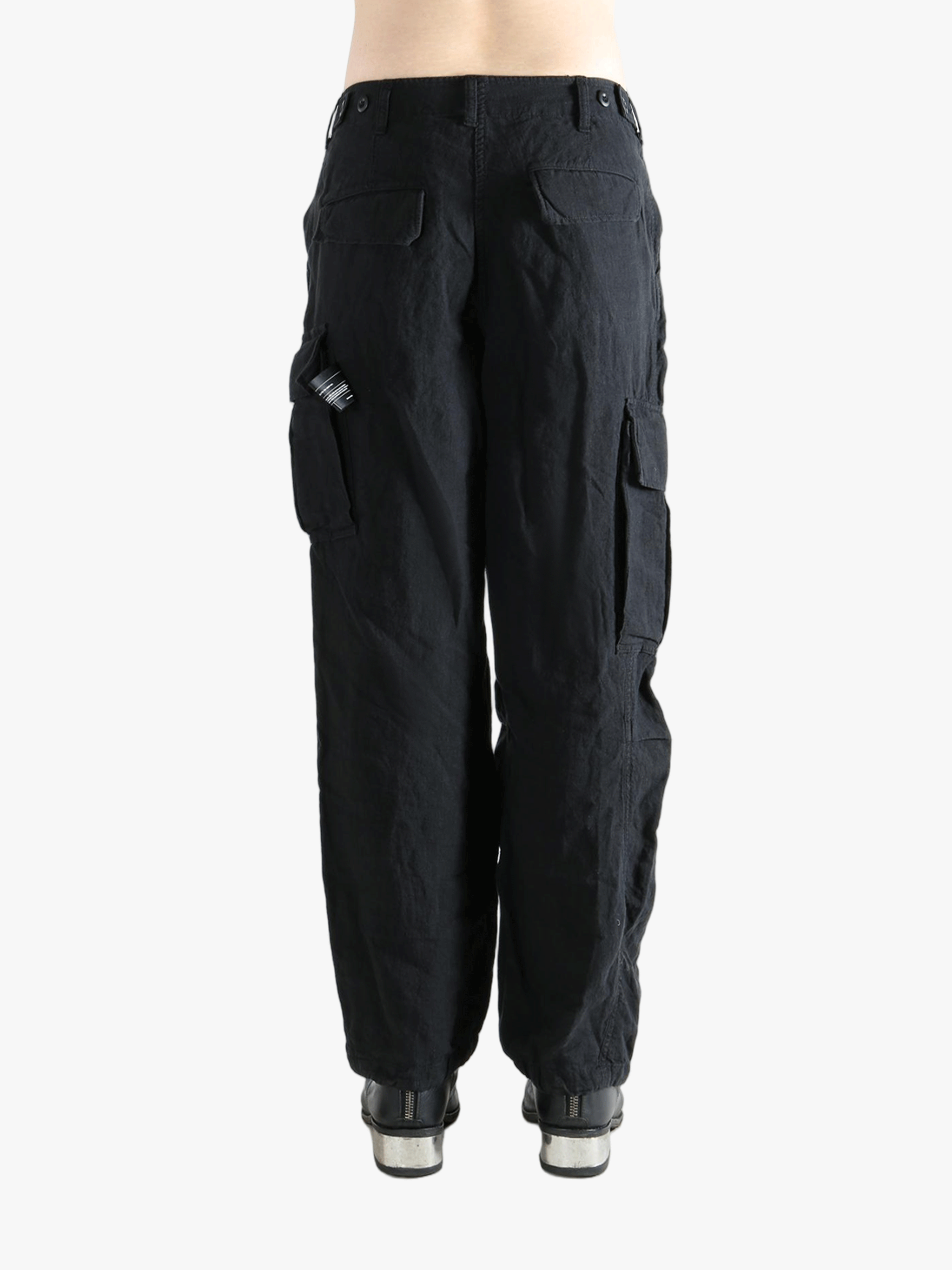 Black pants worn by a person, showing the pants fit