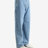 Blue jeans worn by a person, showing the jeans' fit