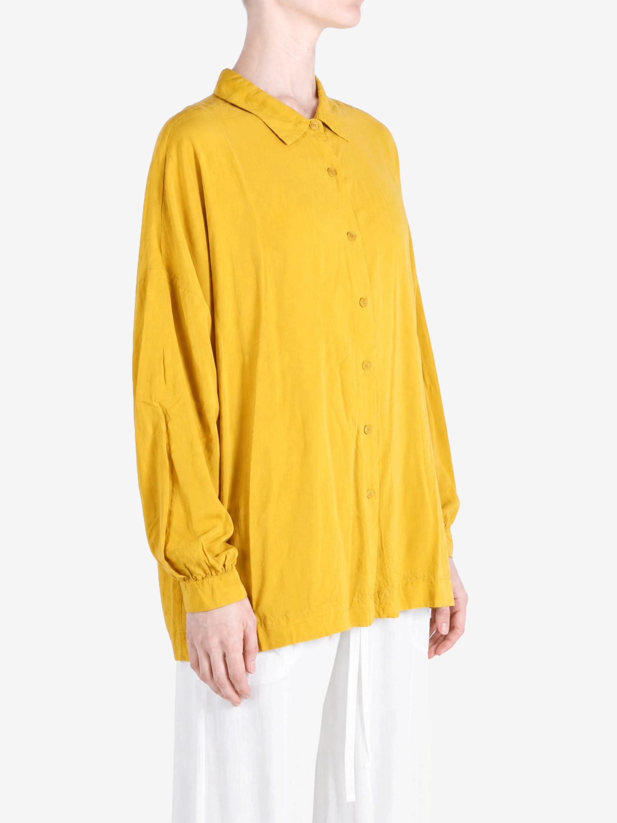 Yellow shirt worn by a person, showing the shirt fit