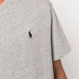 Close up of grey T-shirt, showing texture of the cotton fabric