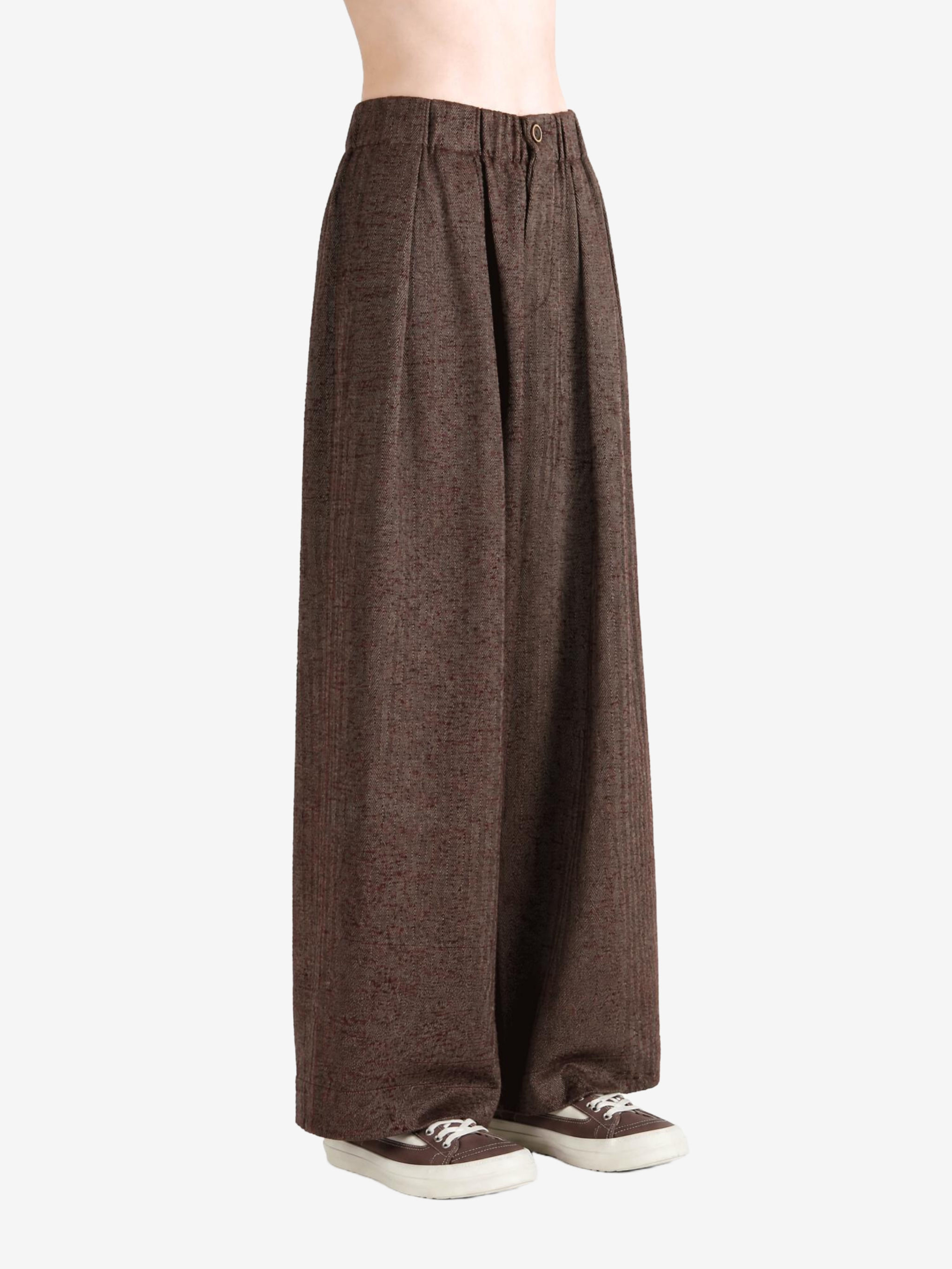 Brown pants worn by a person, showing the pants fit