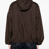 Brown jacket worn by a person, showing the jacket's fit