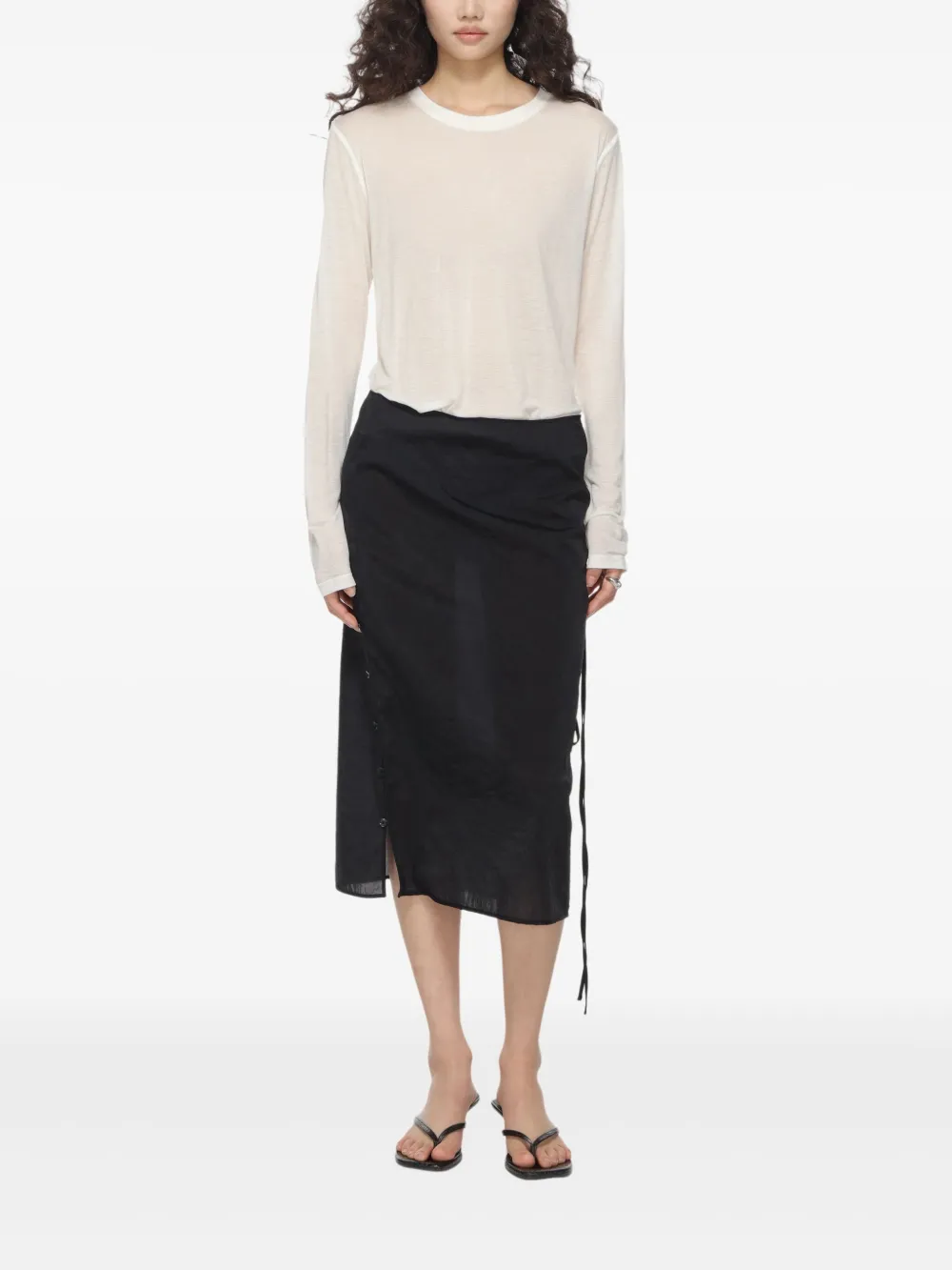 White T-shirt worn by a person, showing the T-shirt's fit