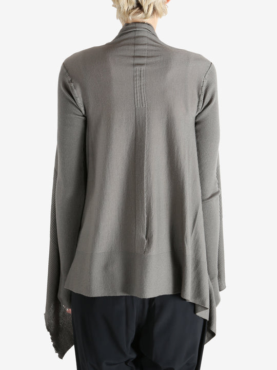 Grey knitwear worn by a person, showing the knitwear fit