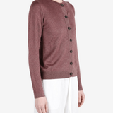 Burgundy knitwear worn by a person, showing the knitwear fit