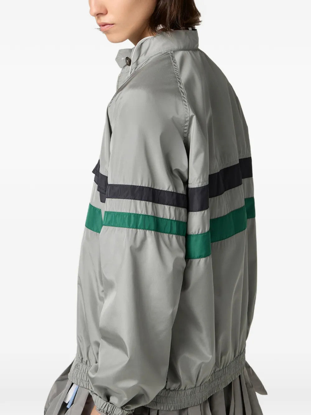 Grey jacket worn by a person, showing the jacket fit