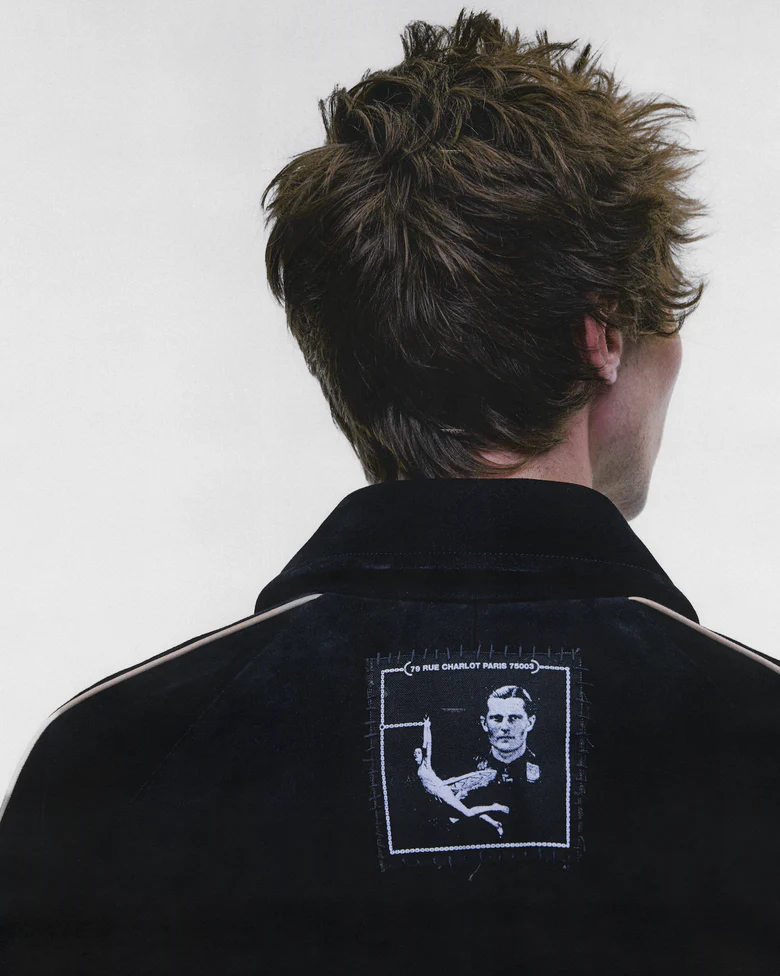 Black jacket worn by a person, showing the jacket fit