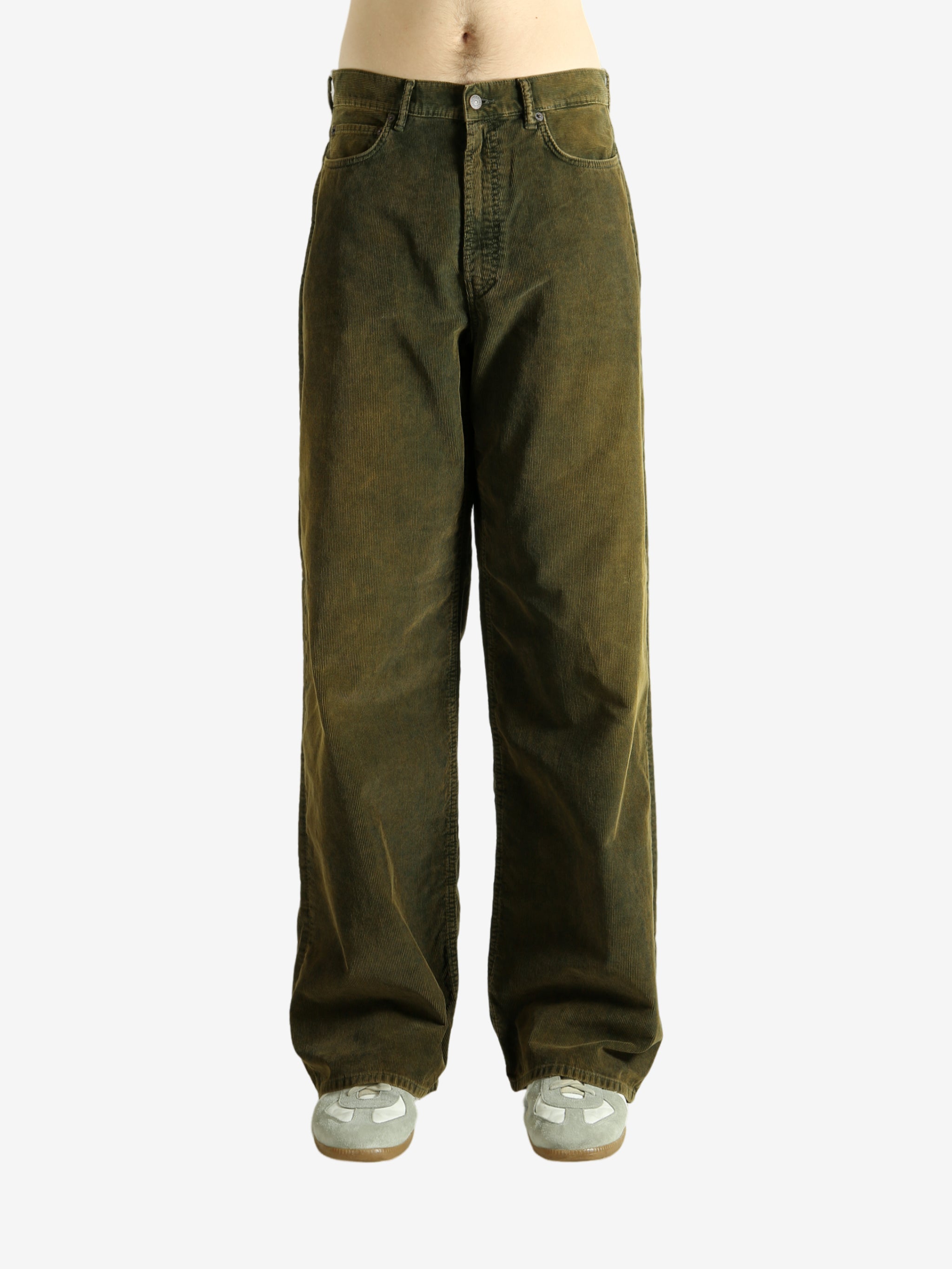 Green pant worn by a person, showing the pant's fit