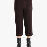 Brown pants worn by a person, showing the pants's fit