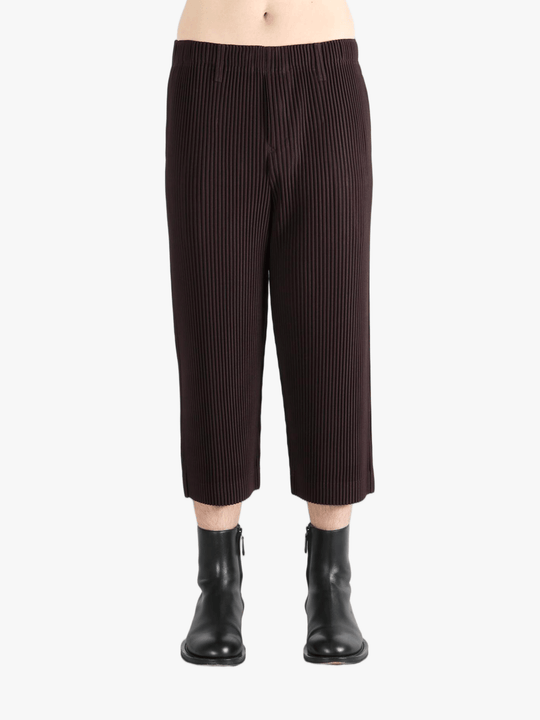 Brown pants worn by a person, showing the pants's fit