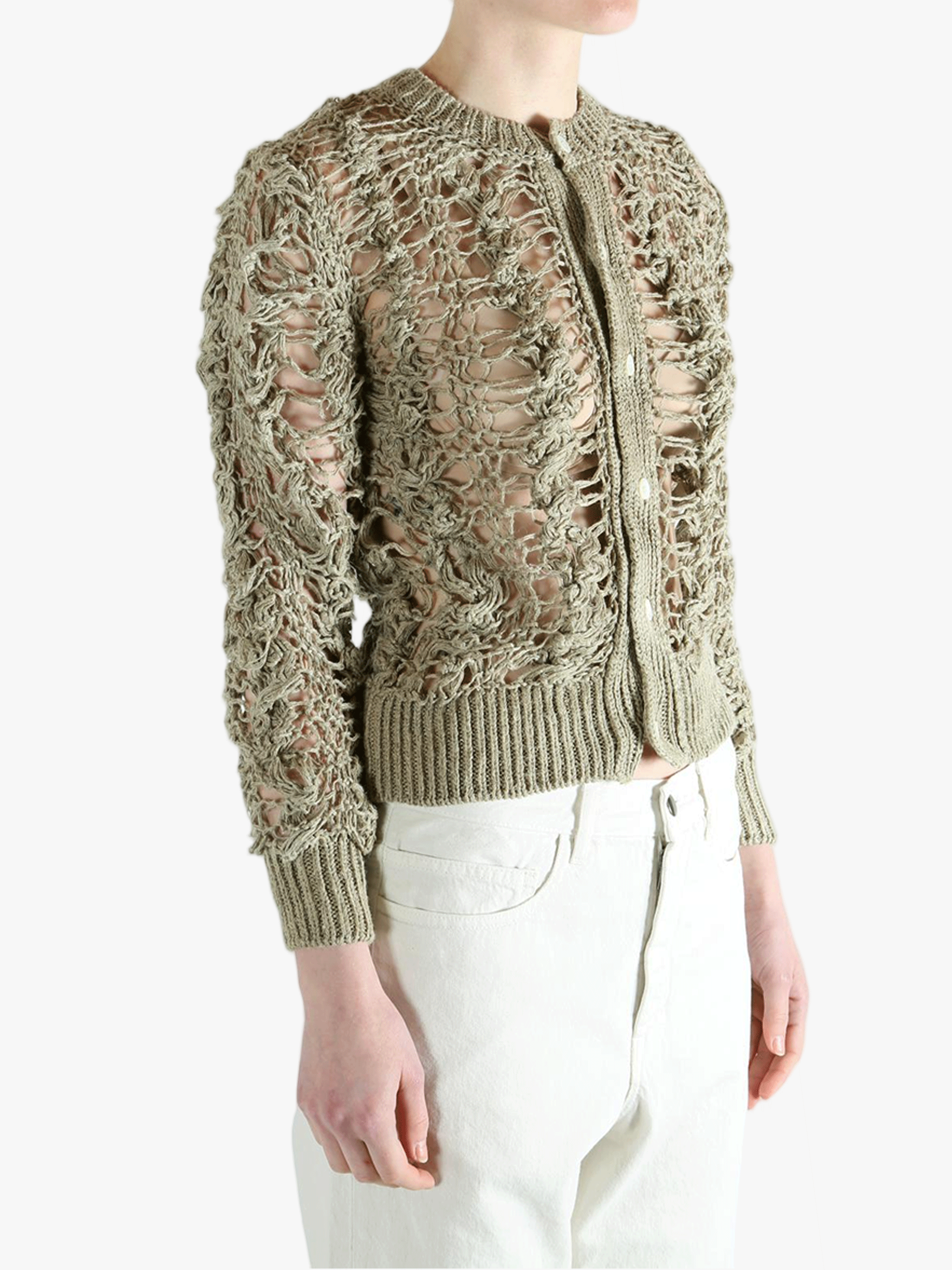 Green knitwear worn by a person, showing the knitwear fit