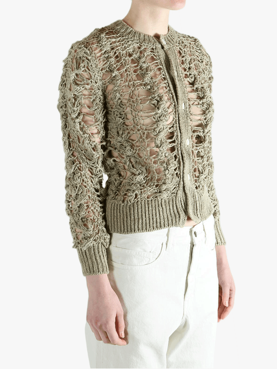 Green knitwear worn by a person, showing the knitwear fit