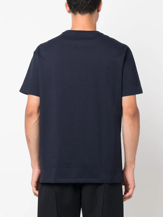 Navy t-shirt worn by a person, showing the shirt's fit