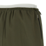 Close up of green skirts, showing texture of the Cotton fabric