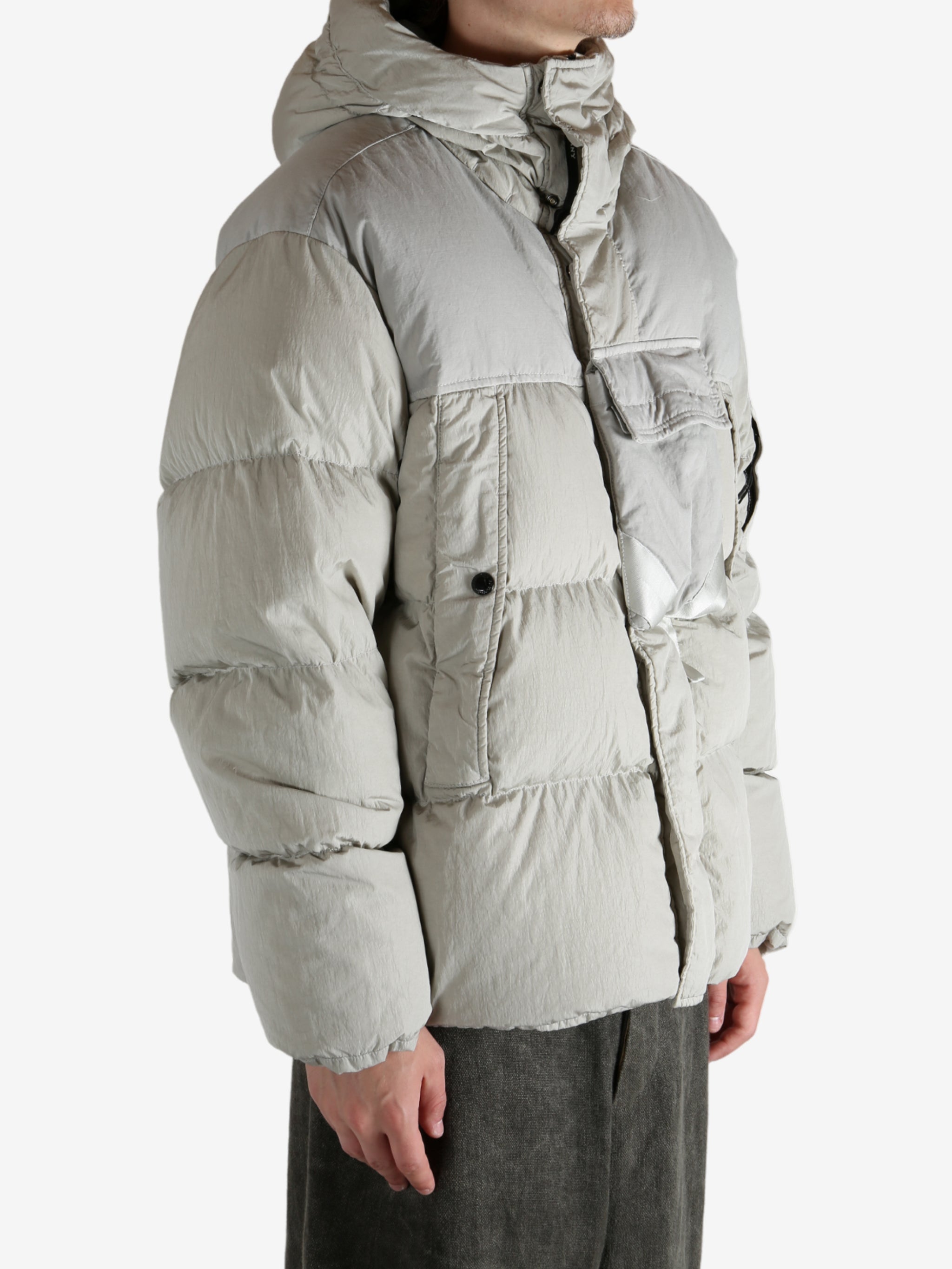 Grey jacket worn by a person, showing the jacket's fit