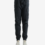 Black pants worn by a person, showing the pants' ft