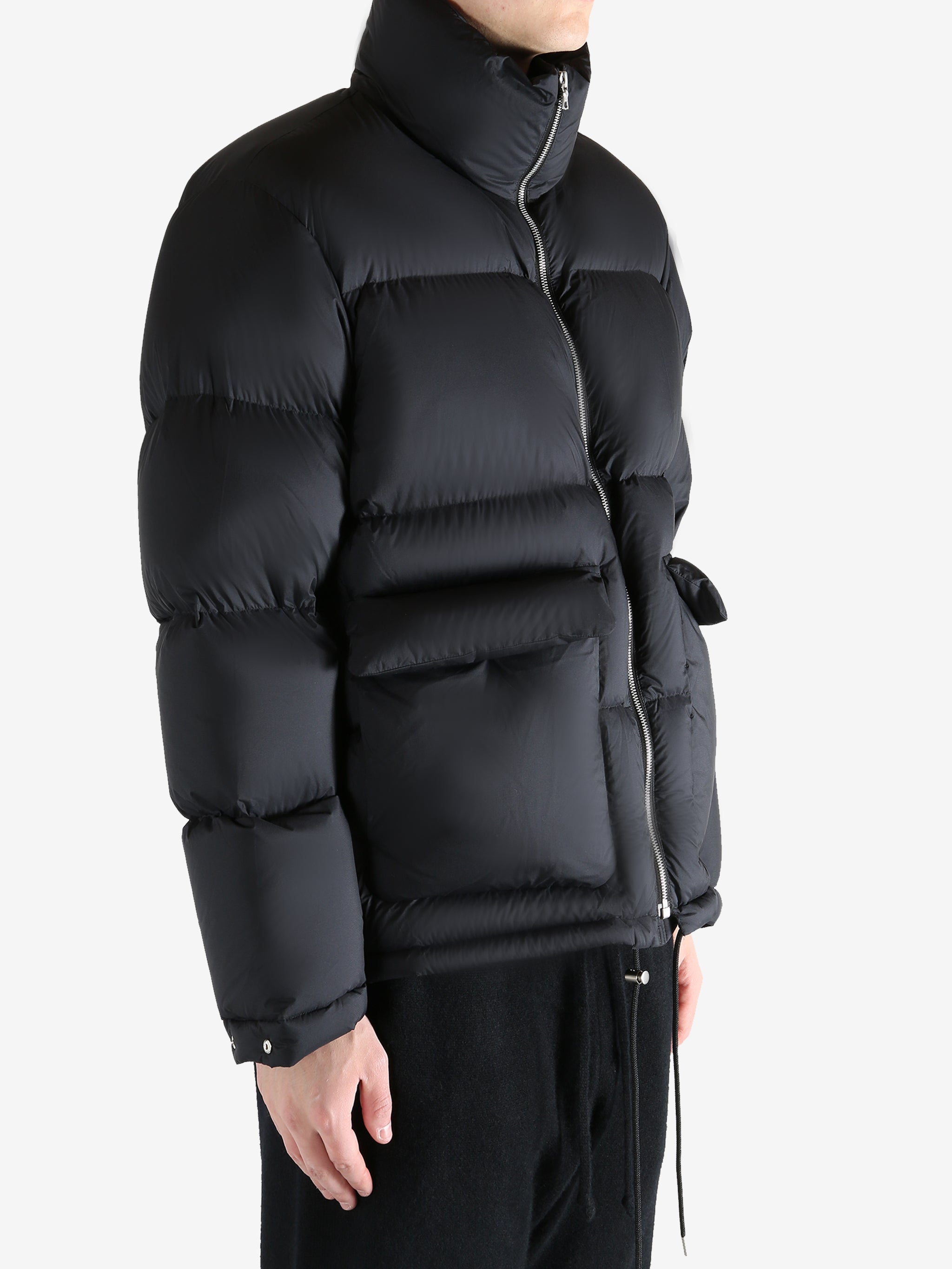 Black jacket worn by a person, showing the jacket's fit