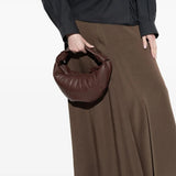 Brown bag worn by a person, showing the bag's fit