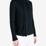 Black top worn by a person, showing the top fit