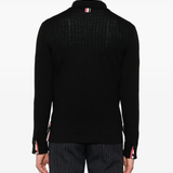 Black shirts worn by a person, showing the shirts fit