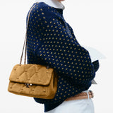 Tan bag worn by a person, showing the bag fit