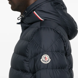 Close up of navy jacket, showing texture of the Polyester fabric