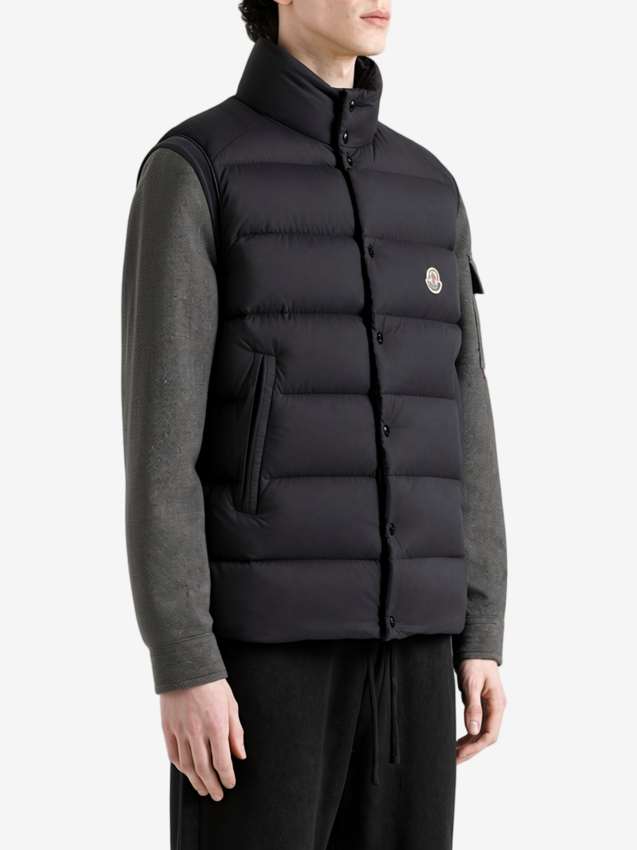 Black jacket worn by a person, showing the jacket fit