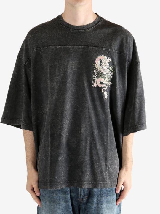 Black t-shirt worn by a person, showing the t-shirt's fit