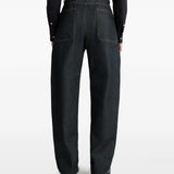 Navy pants worn by a person, showing the pants' fit