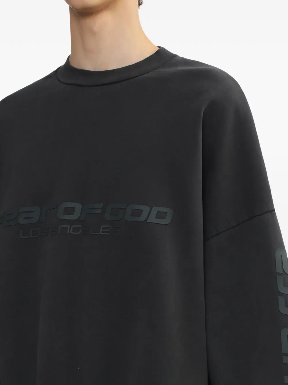 Close up of the black sweatshirt, showing texture of the cotton fabric