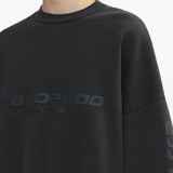 Close up of the black sweatshirt, showing texture of the cotton fabric