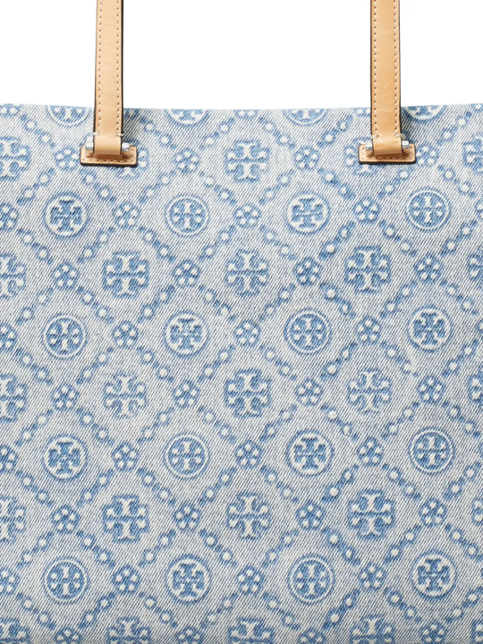 Close up of blue bag, showing texture of the denim fabric