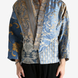 Blue jacket worn by a person, showing the jacket's fit