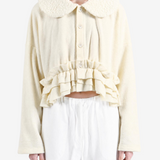 Tan knitwear, front view