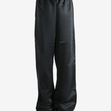 Black pants worn by a person, showing the pants fit