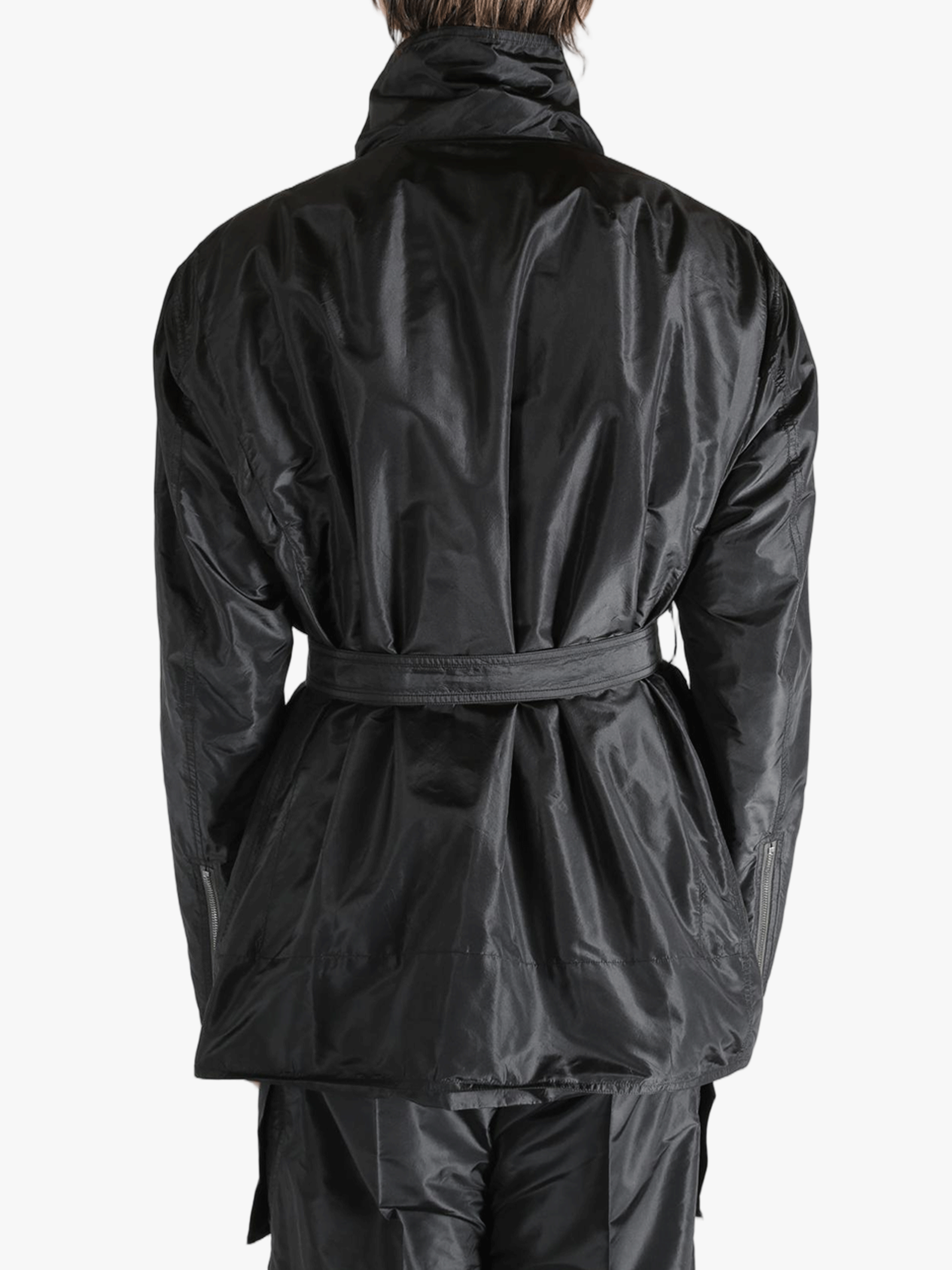 Black jacket worn by a person, showing the jacket's fit