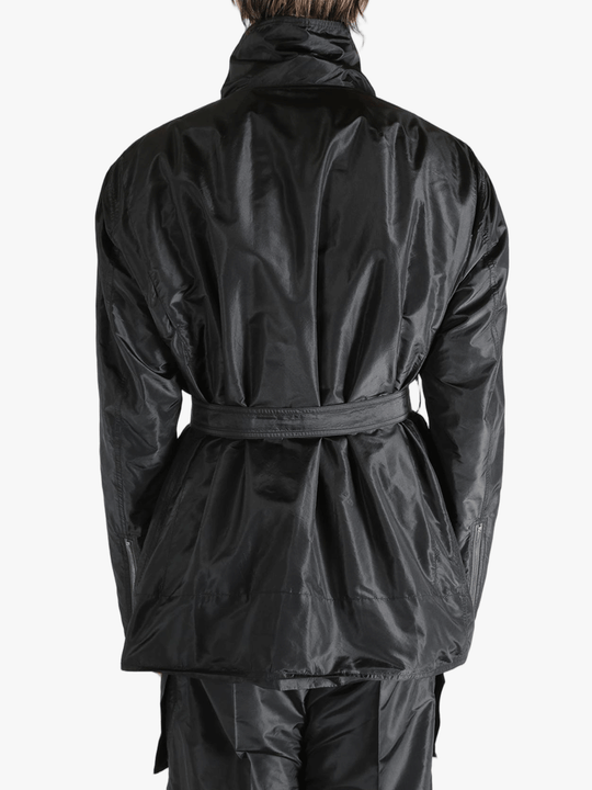 Black jacket worn by a person, showing the jacket's fit