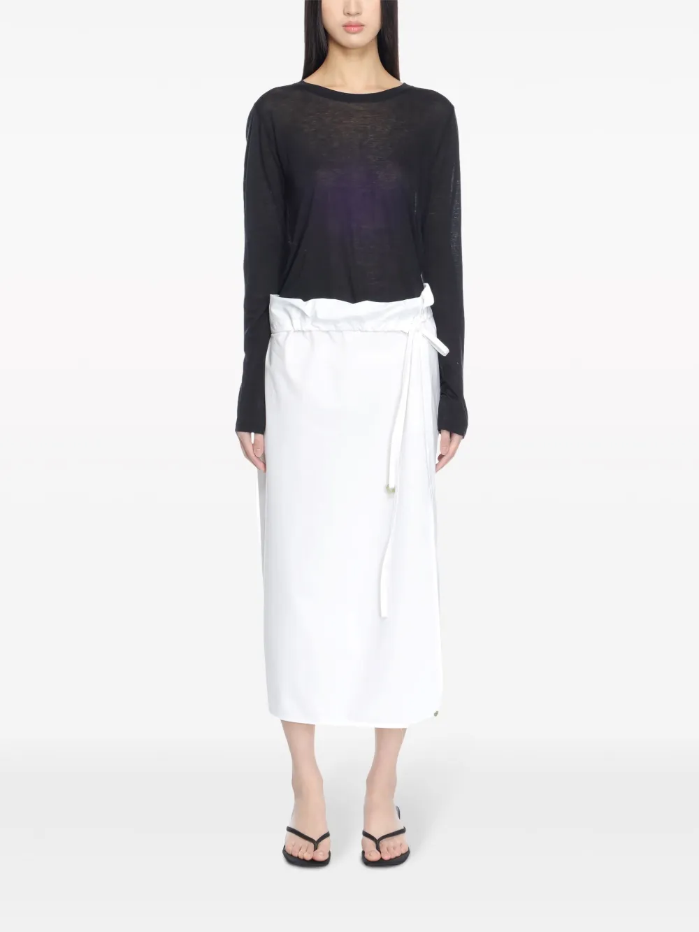 Black top worn by a person, showing the top's fit