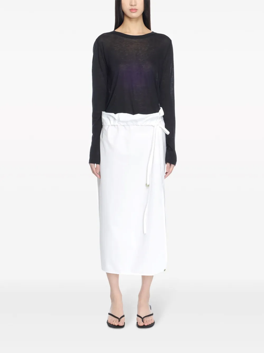 Black top worn by a person, showing the top's fit