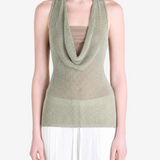 Green top worn by a person, showing the top fit