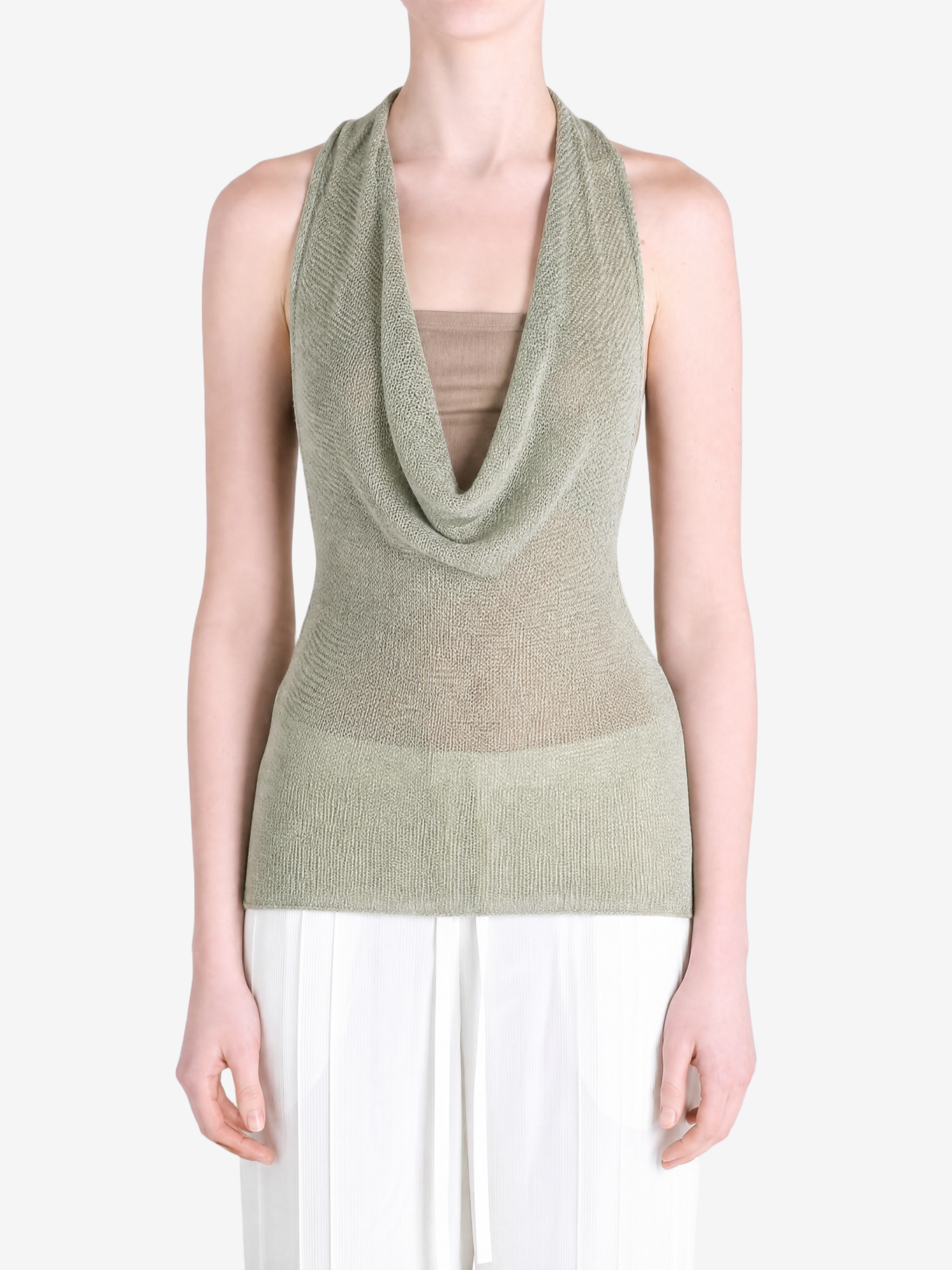 Green top worn by a person, showing the top fit