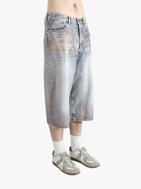 Blue shorts worn by a person, showing the shorts fit