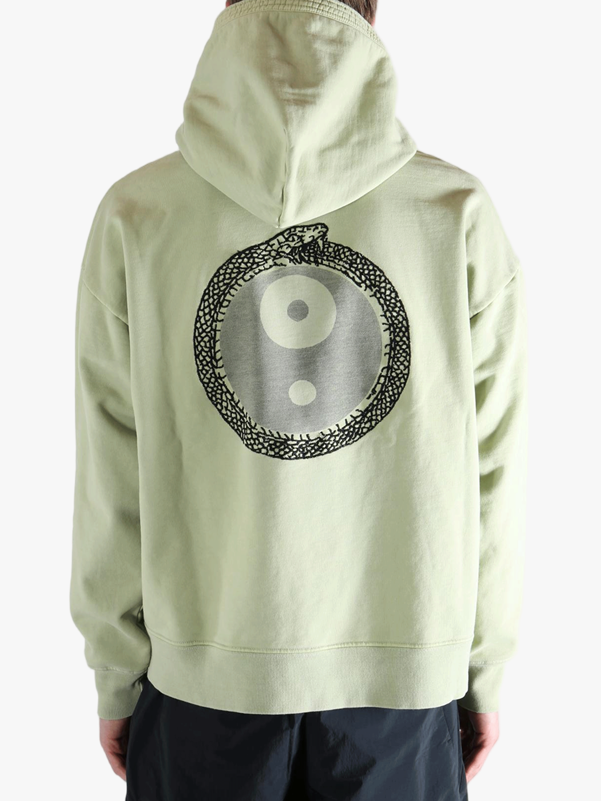 Green hoodie worn by a person, showing the hoodie's fit