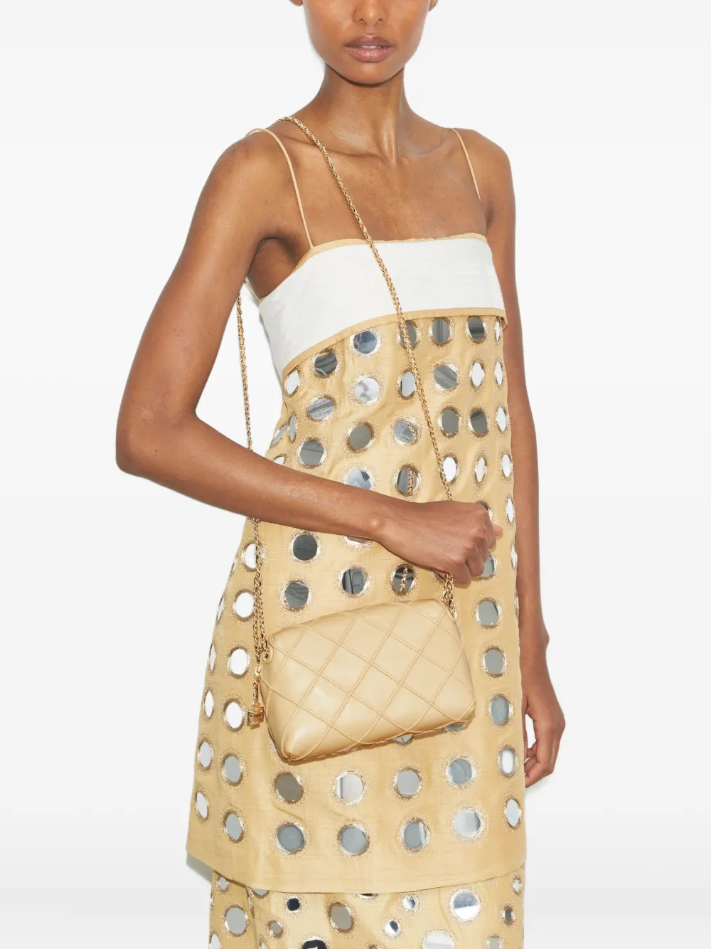 Tan bag worn by a person, showing the bag's fit