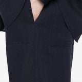 Close up of  navy pants, showing texture of the viscose fabric