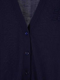 Close up of navy knitwear, showing texture of cashmere and silk fabric